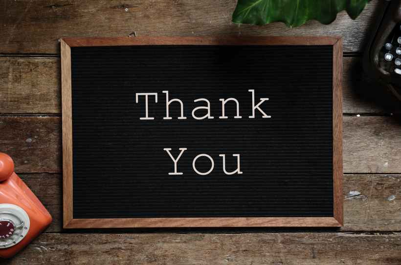 thank you text on black and brown board