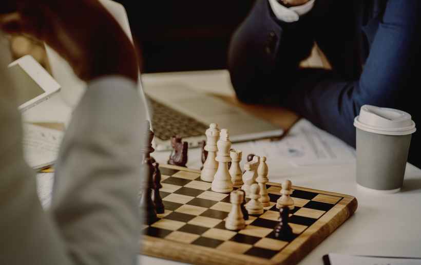 person playing chessboard set