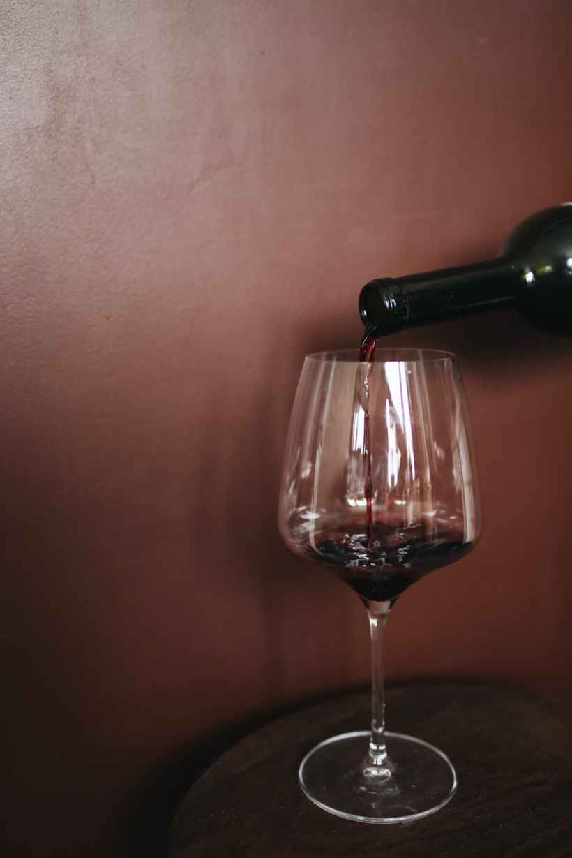 clear wine glass with red wine